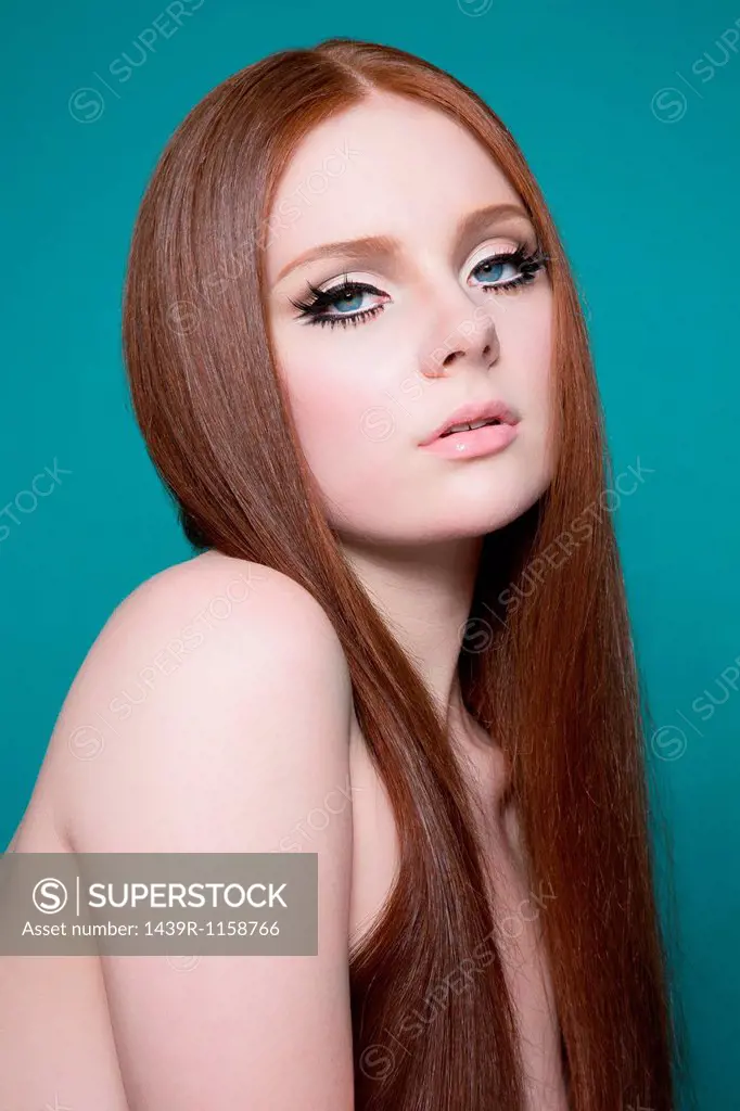 Portrait of woman with long red hair