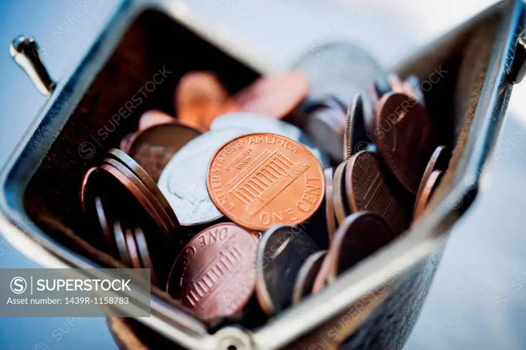 Purse filled with coins