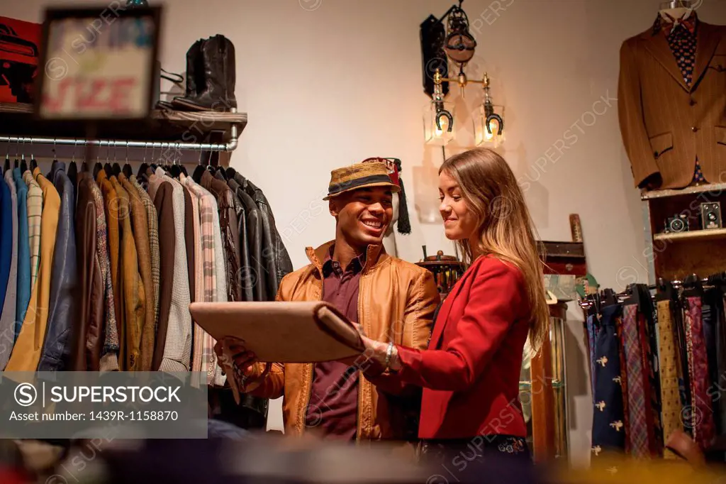 Young couple in vintage clothes shop