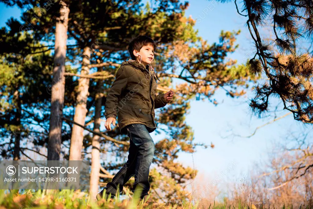 Boy walking in countryside