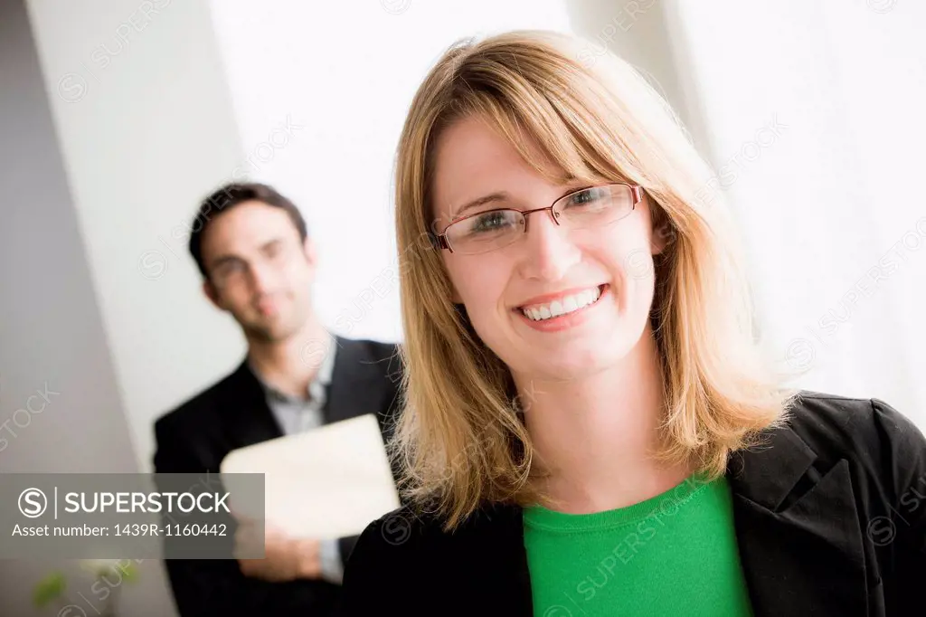 Portrait of female office worker wearing glasses