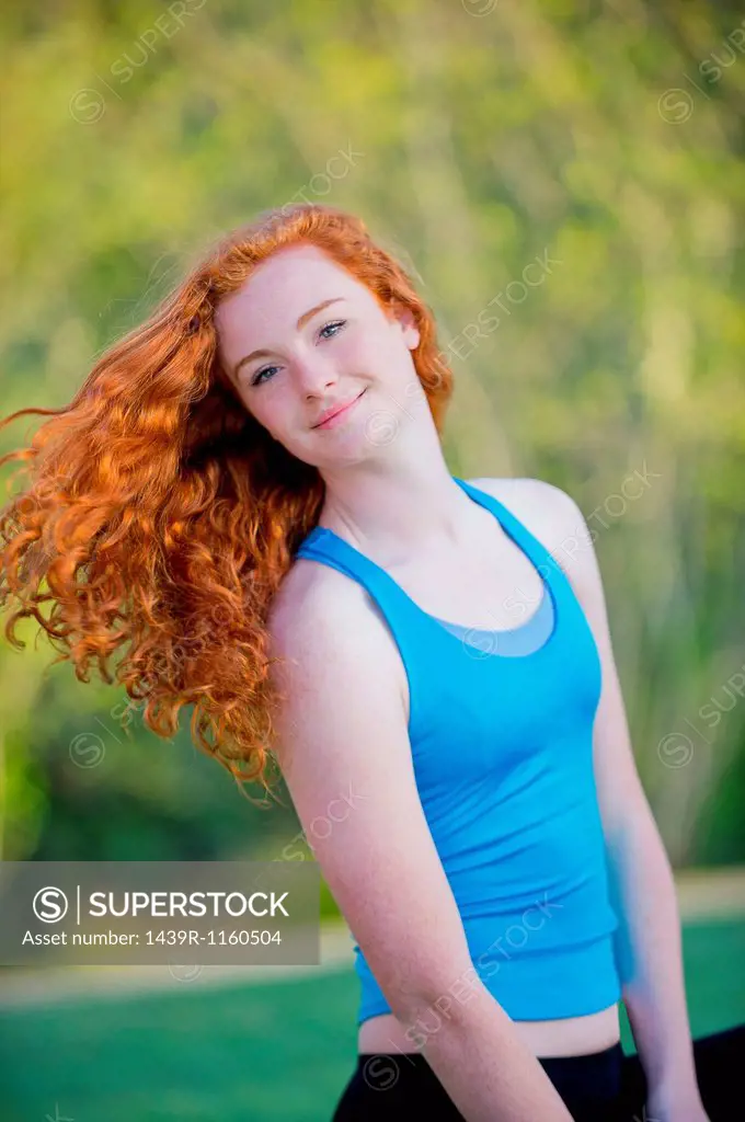 Portrait of teenage girl with long red hair