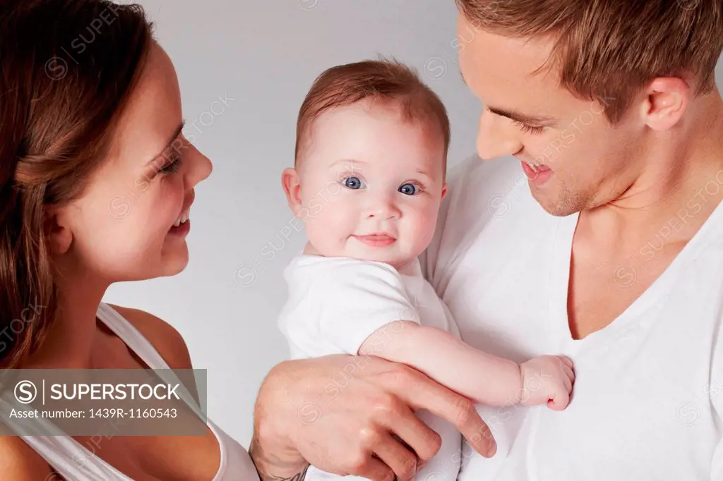 Mother and father with baby daughter