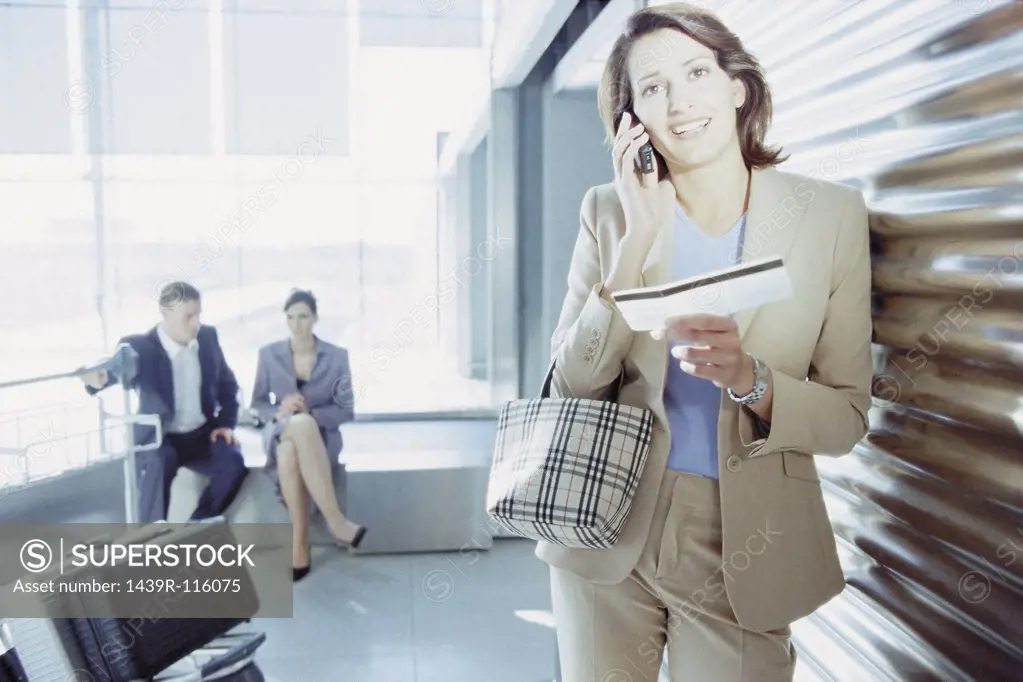 Businesswoman checking airline ticket