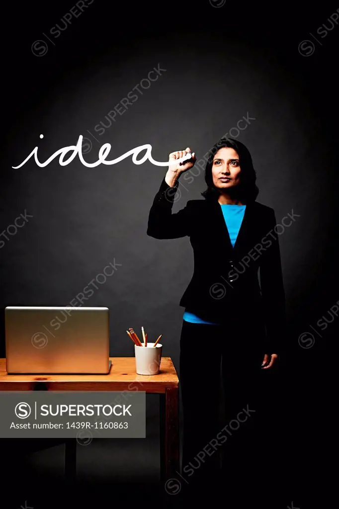 Woman writing down idea