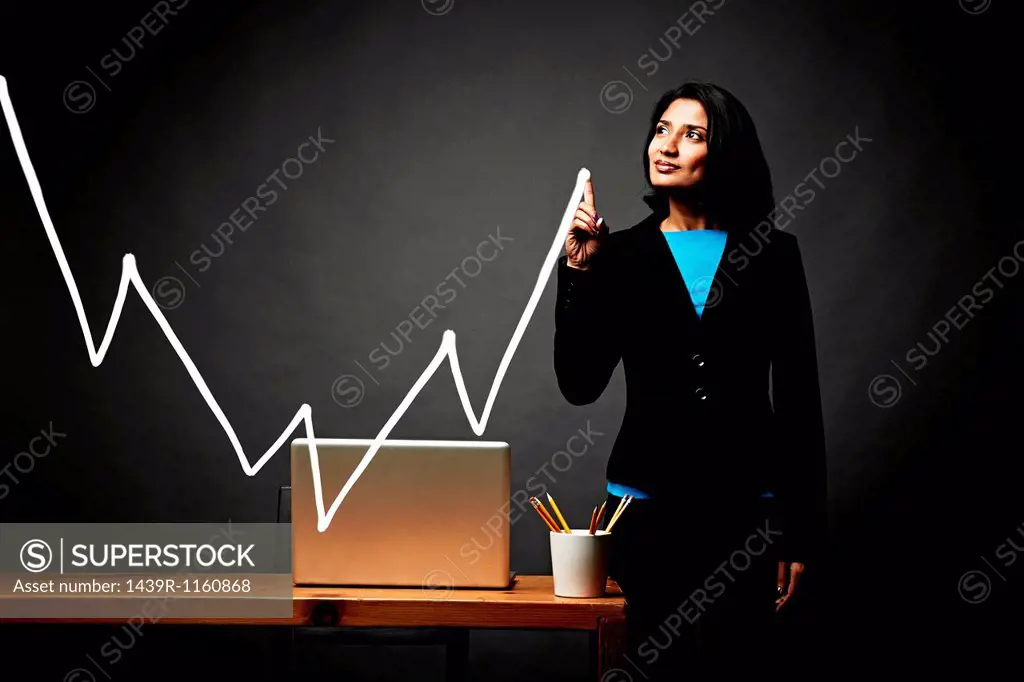 Woman drawing line graph