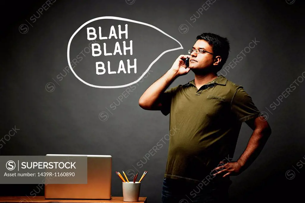 Man listening intently on mobile phone