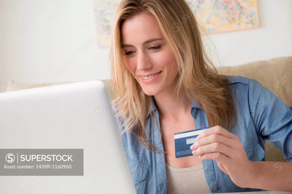 Woman holding credit card