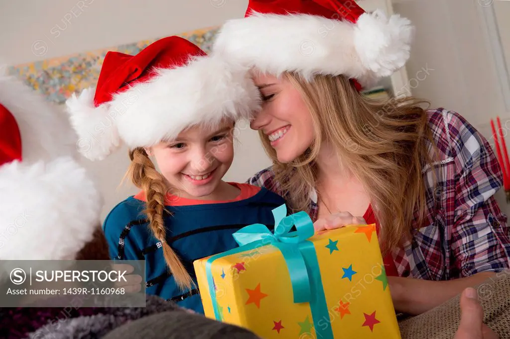Girl looking at christmas gift