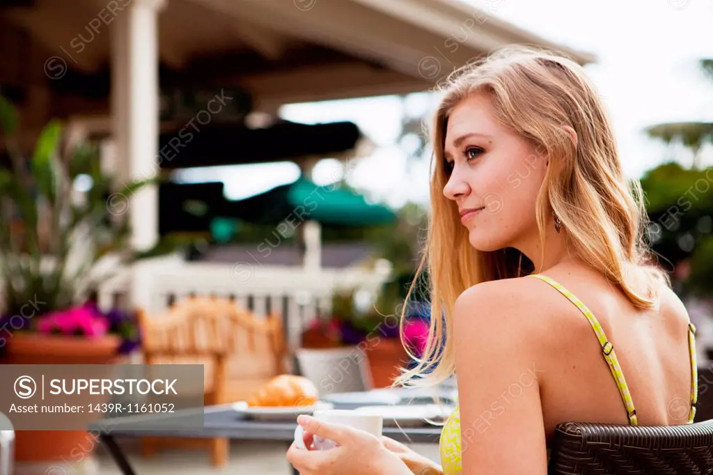 Woman in outdoor café relaxing