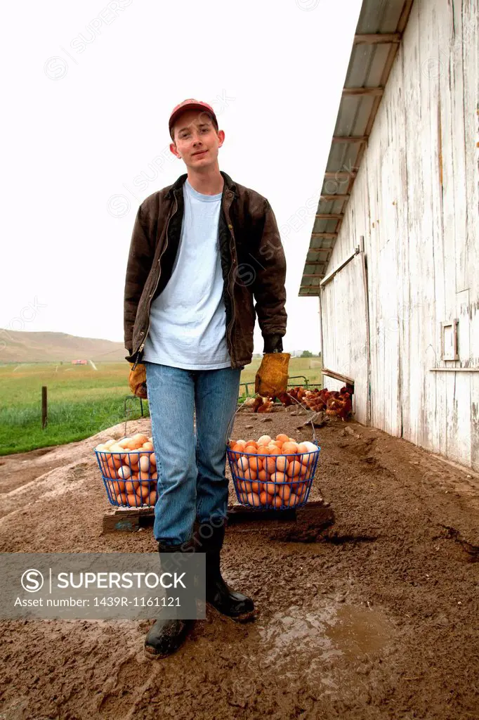 Farmer carrying two baskets of eggs