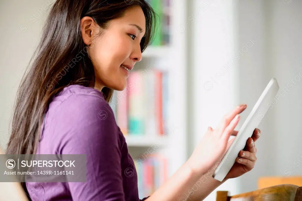 Close up of woman using digital tablet