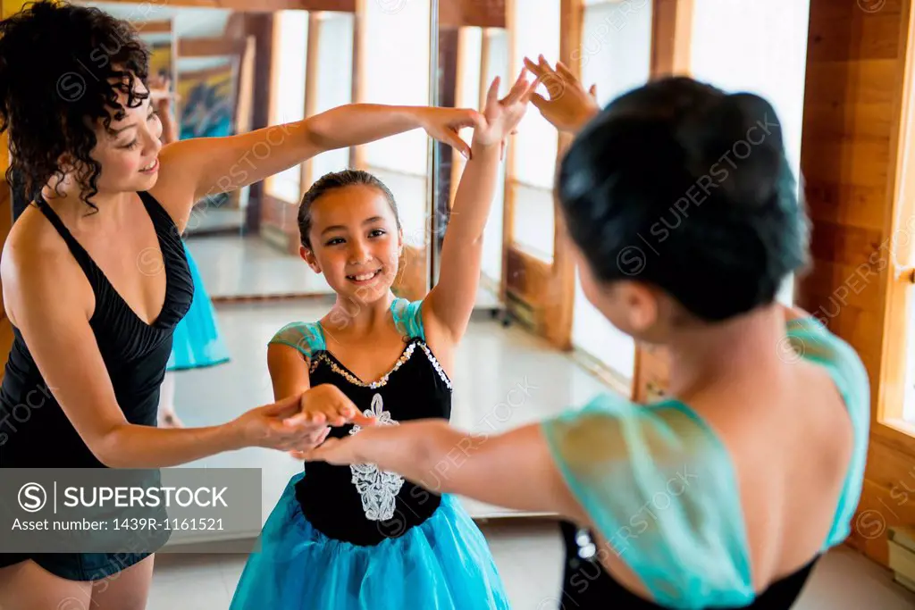 Mature woman teaching ballerinas