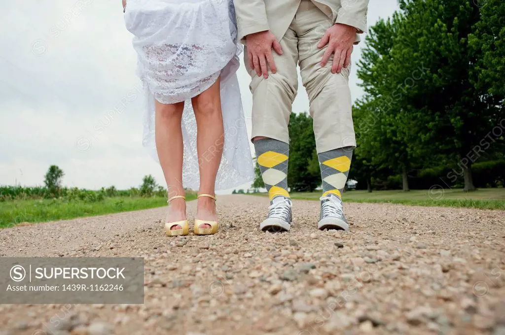 View of couples legs on wedding day