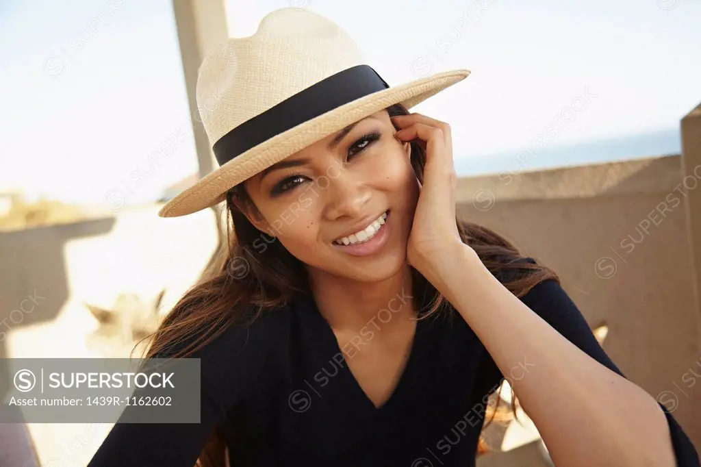 Portrait of young woman in hat, Palos Verdes, California, USA