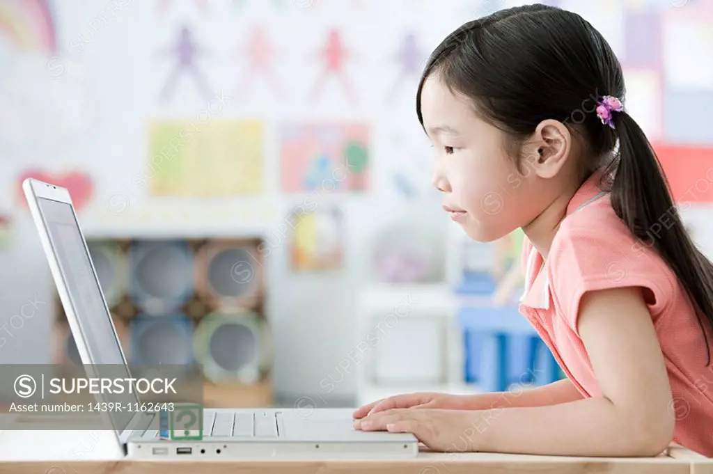 A girl using a laptop