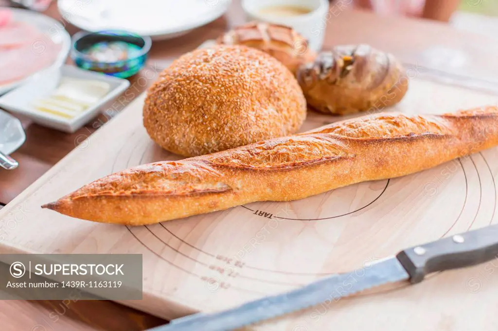 Variety of bread on chopping board