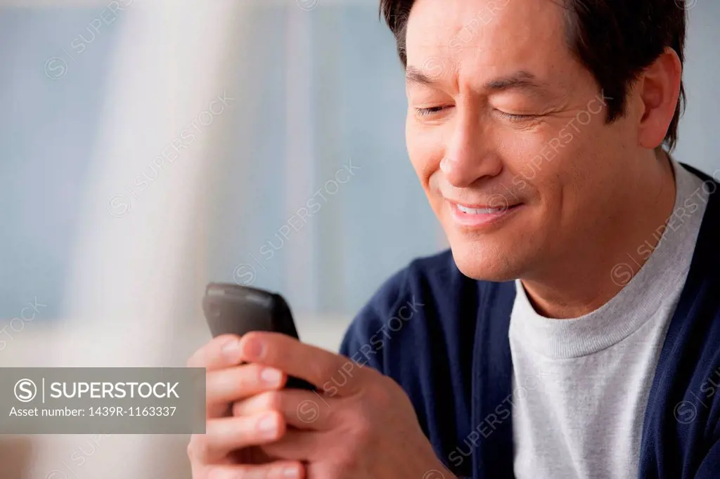 Mature man using cell phone