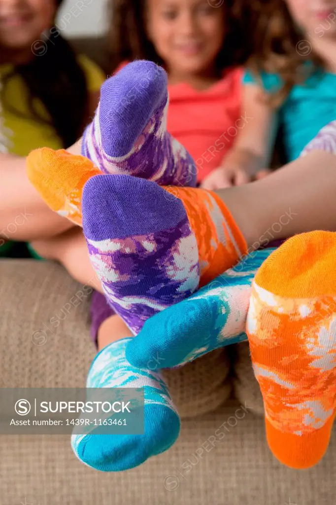 Girls wearing brightly coloured socks