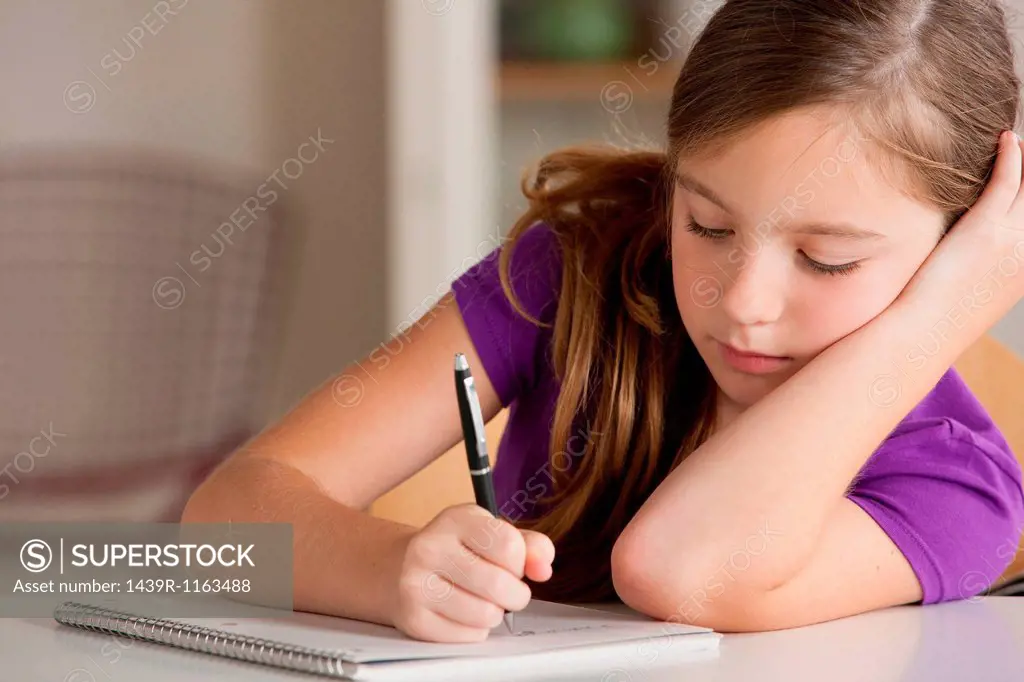 Girl writing in notebook