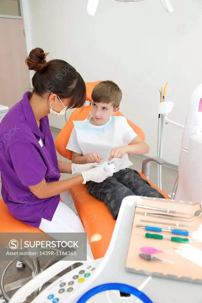 Dental nurse preparing patient for treatment