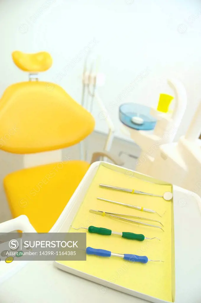Dental chair and surgical tray in clinic