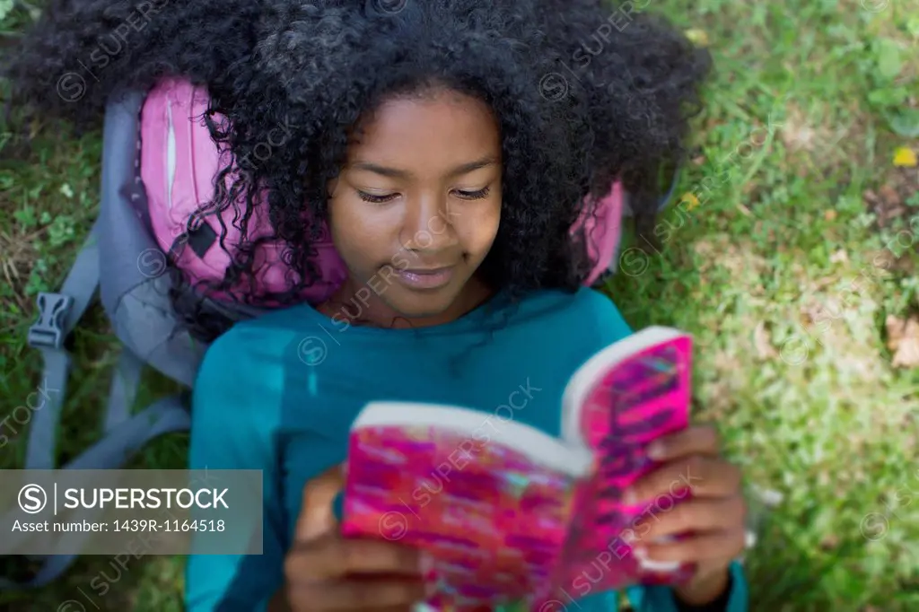 Close up of girl reading in park