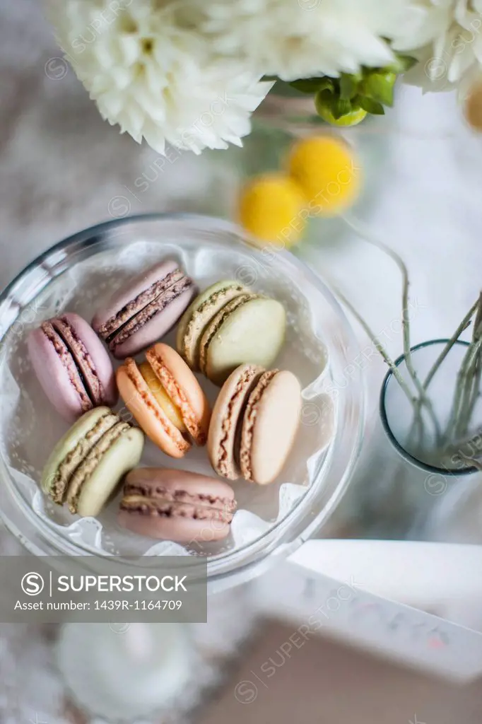 Still life of macaroons with flowers and decoration