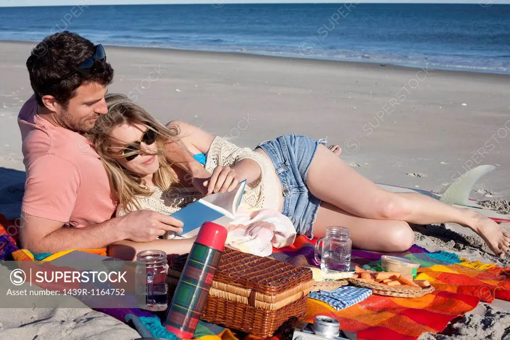 Couple sharing picnic on beach, Breezy Point, Queens, New York, USA