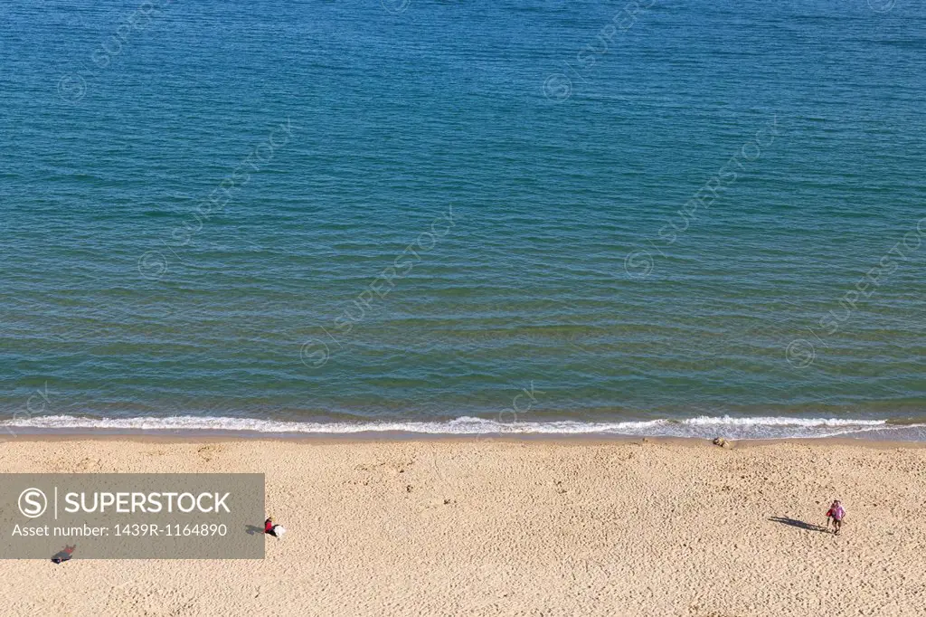 People on beach, Poole, Dorset, UK