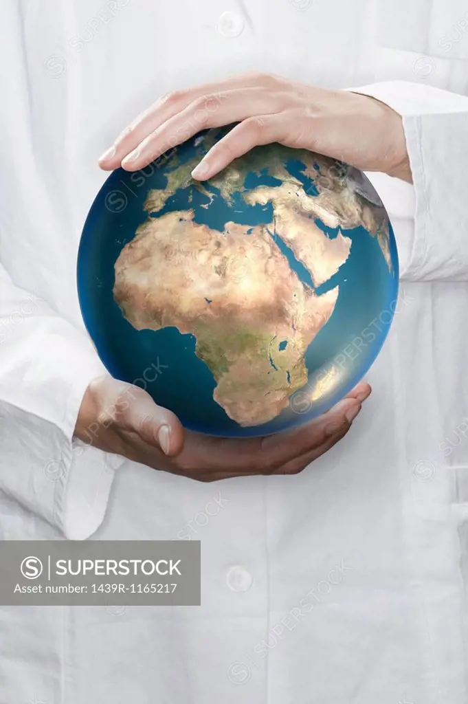 Scientist holding a globe