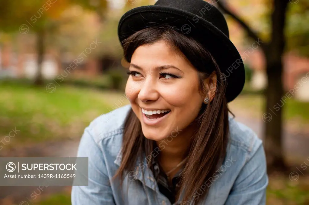 Woman with hat in park