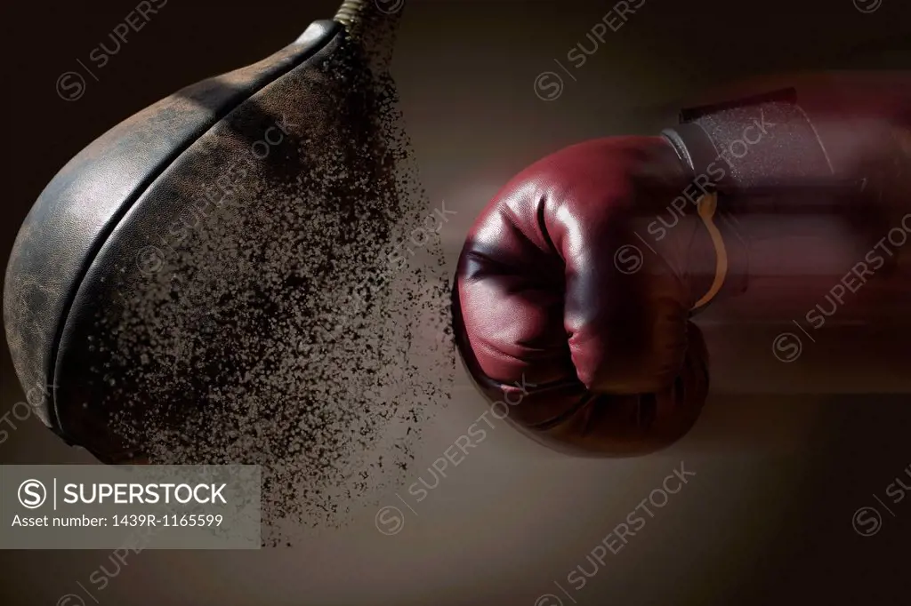 Close up boxer and punch bag with blurred motion