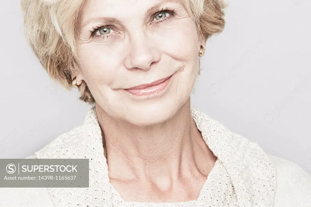 Cropped studio portrait of senior woman smiling