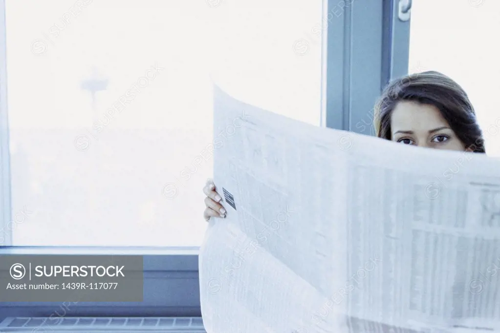 Businesswoman reading stocks and shares
