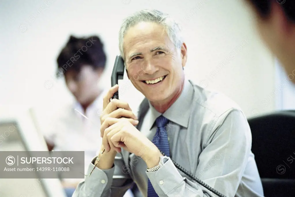 Businessman on telephone in office