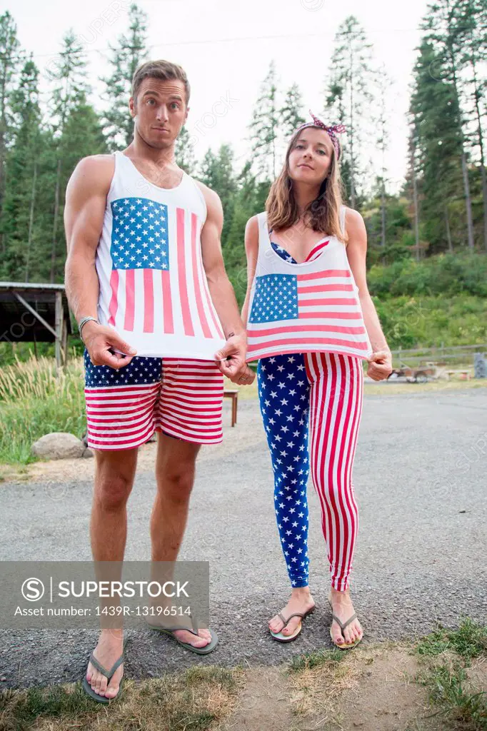 Portrait of couple showing off American flag costume celebrating Independence Day, USA