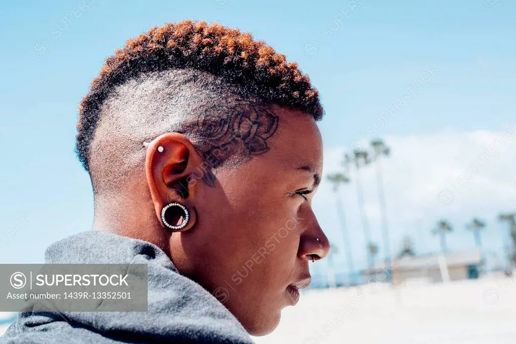 Portrait of woman with mohawk looking away