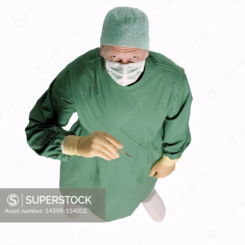 Surgeon holding scalpel