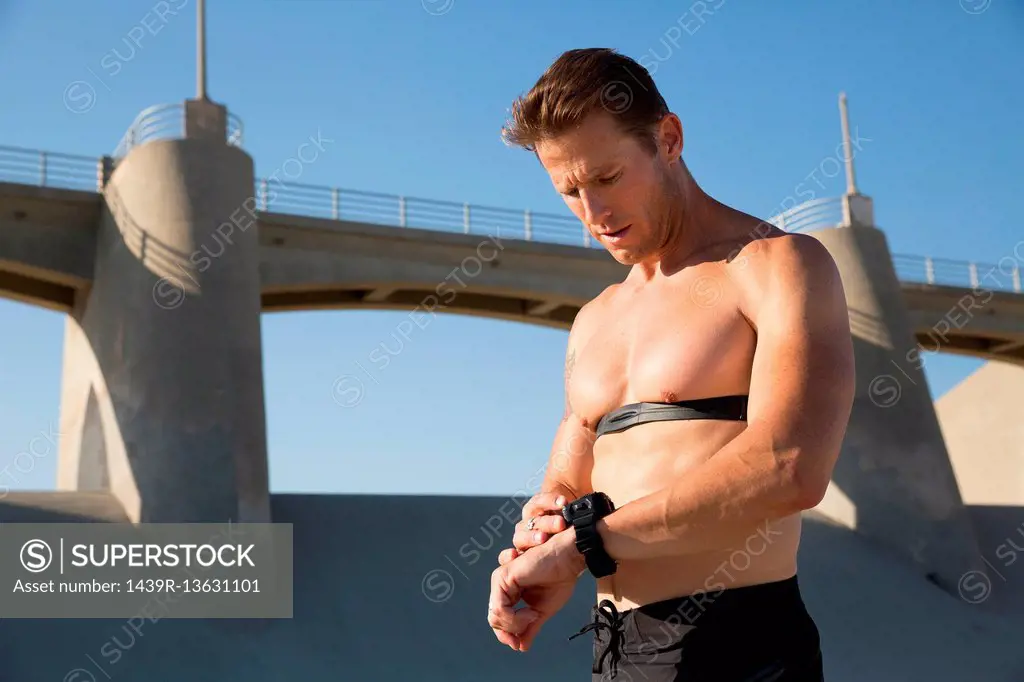 Male athlete checking smartwatch, Van Nuys, California, USA