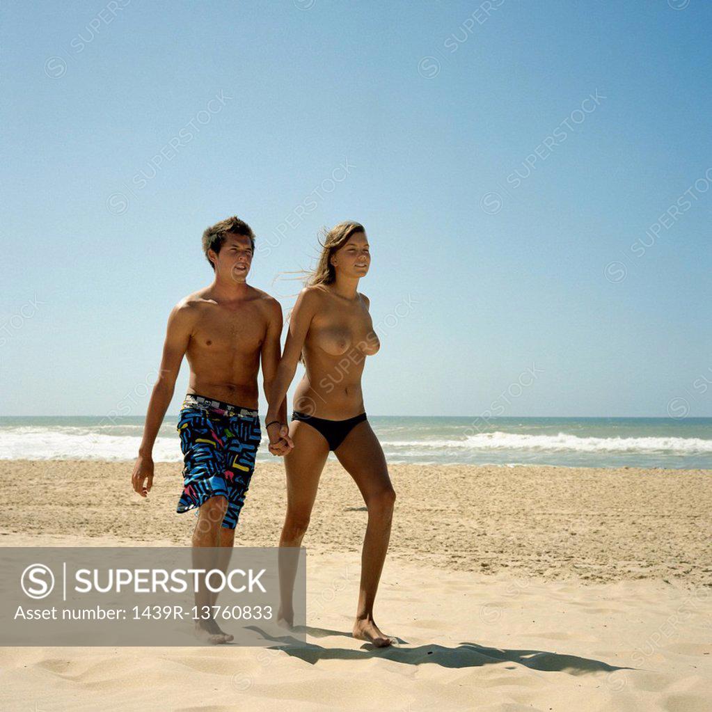 Walking on beach nude