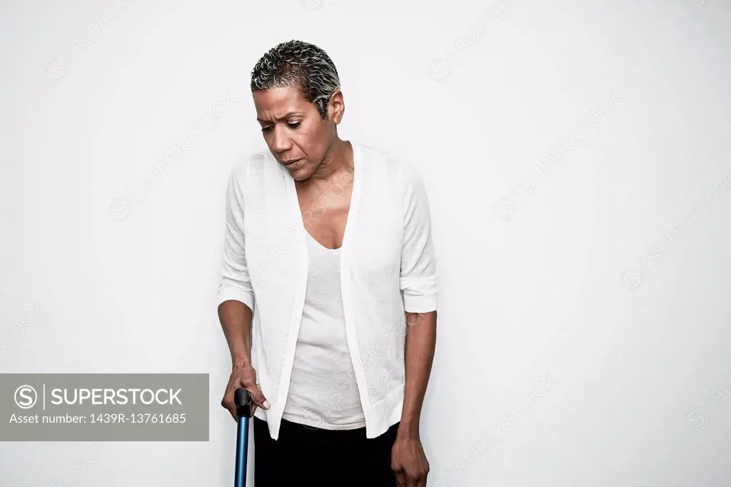 Senior woman using walking stick