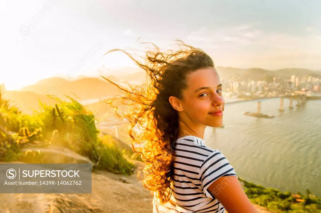 Girl at view point during sunset, Rio de Janeiro, Brazil