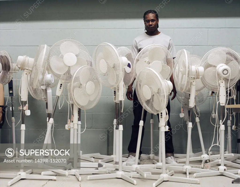 Man trapped by electric fans