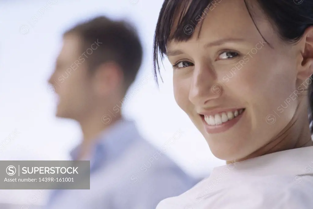 Smiling woman with colleague