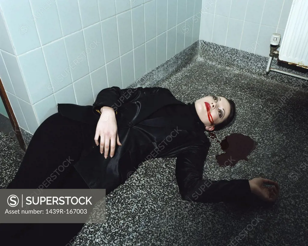 Woman lying dead on the floor