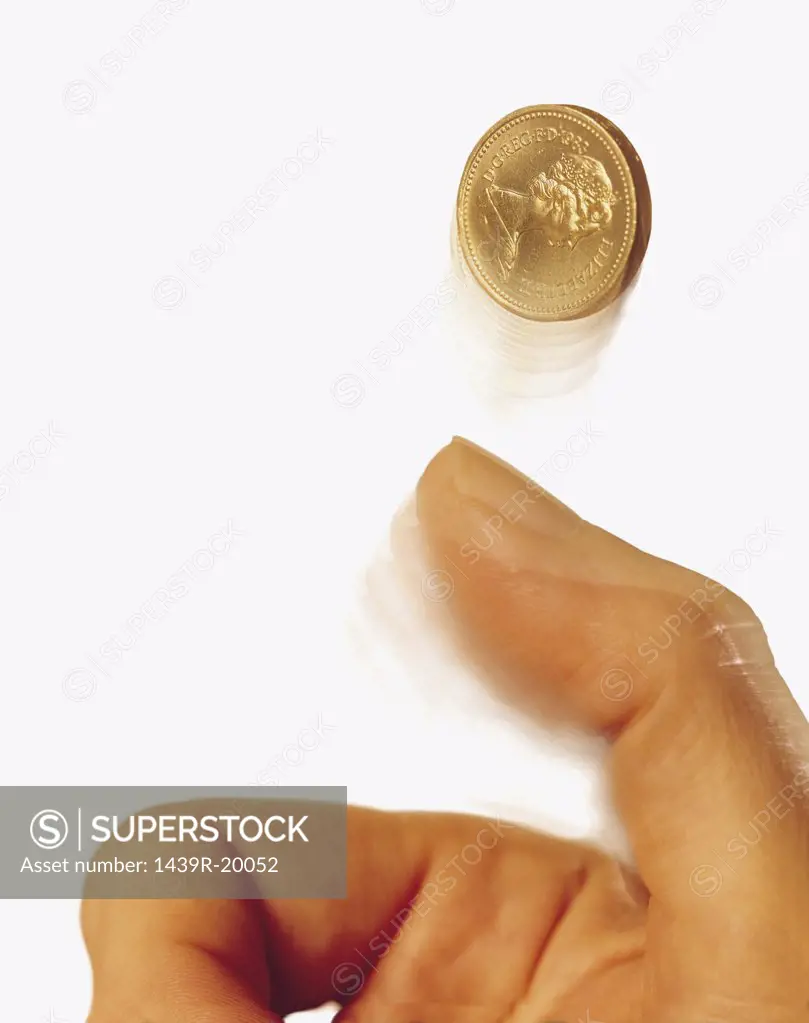 Hand tossing coin