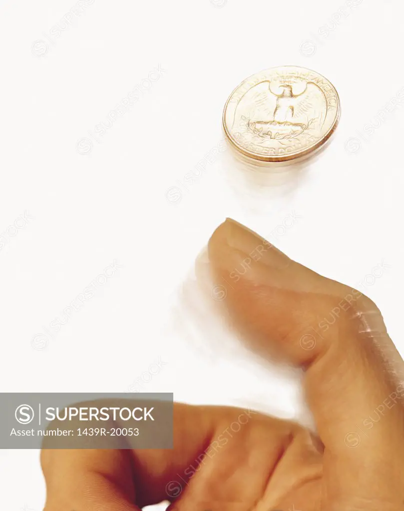 Hand tossing coin