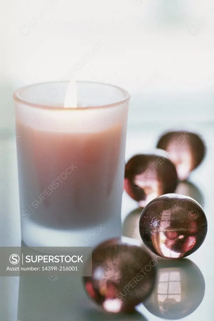 Candle with bath pearls