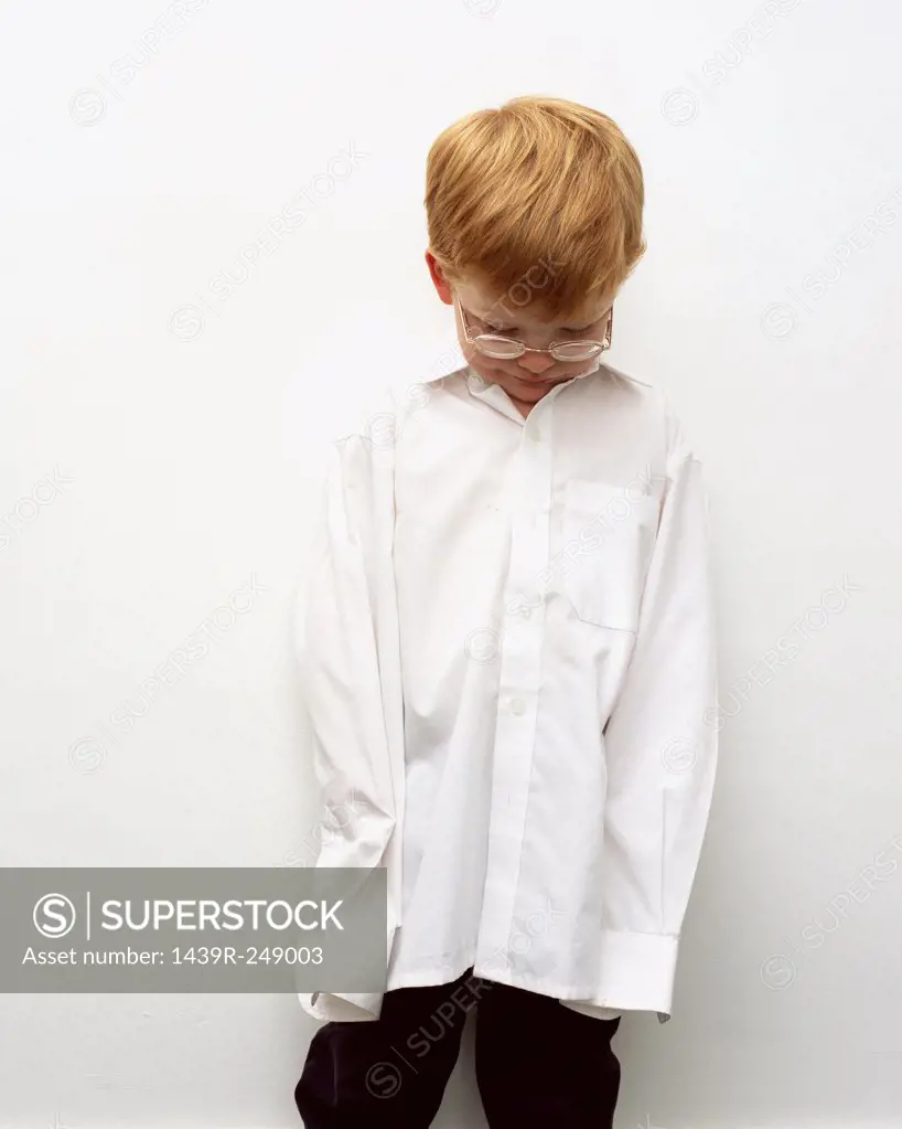 Young boy in oversized shirt